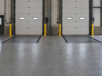Coated floor in front of two dock levellers