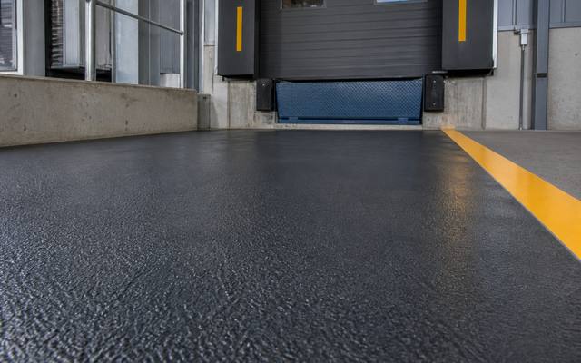Repaired and recoated concrete floor at a loading dock in Red Deer
